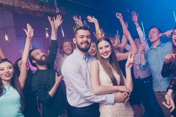 Portrait of cheerful people piggy-backing show two fingers make v-signs dance floor disco