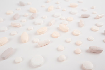 High number of pills on white background surface. High resolution image for pharmaceutical industry.