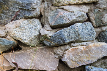 Cobblestone wall. Stone wall background. Modern outdoor.