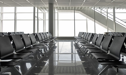 Row of black chairs at airport, shot in Europe - Munich