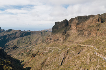 Winding mountain road leading to a small village Masca village between the mountains on Tenerife, Canary Islands, Spain