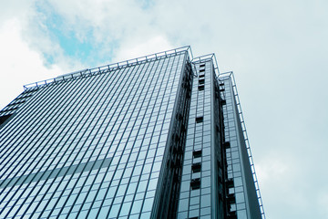 Fototapeta na wymiar Skyscraper and tower of business center, blue sky, Business concept. Banner