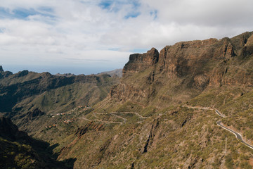 Winding mountain road leading to a small village Masca village between the mountains on Tenerife, Canary Islands, Spain