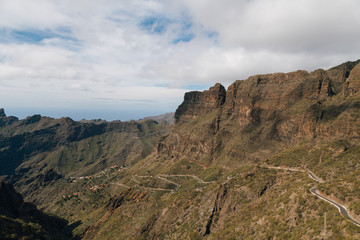 Winding mountain road leading to a small village Masca village between the mountains on Tenerife, Canary Islands, Spain