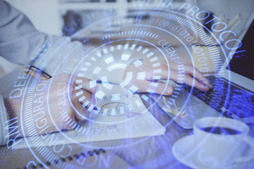 Businessman working on Laptop with technology theme drawing. Concept of big data. Double exposure.