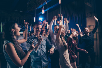 Listen favorite singer band concert. Millennial charming people free time enjoy noise loud cheerful exciteemnt indoors wear dress suit lights