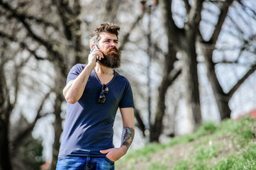 Bearded man call cell phone. Communication concept. Try call later. Redirected call. Listening message. Unavailable at the moment. Hipster with beard using mobile phone. Man with beard calling