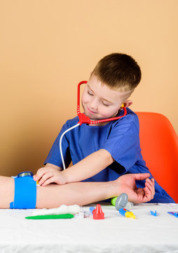 kid measuring preasure to patient. family doctor. Treatment prescription. pediatrician intern. little boy in medical uniform. hospital. medicine and health. kid doctor with stethoscope. patient.
