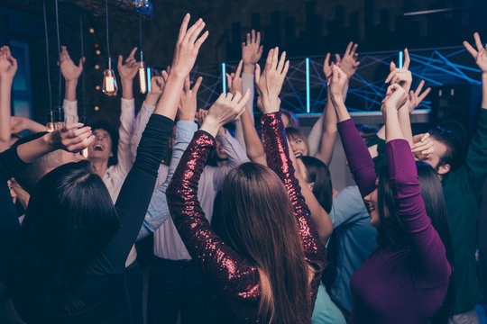 Nice-looking attractive cheerful glad positive stylish chic ladies and gentlemen having fun feast tradition custom dj set edm free time weekend in fashionable luxury place nightclub indoors