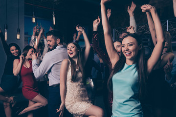 Nice-looking attractive lovely glamorous cheerful cheery positive elegant stylish diverse ladies and gentlemen having fun enjoying festal festive occasion in fashionable luxury nightclub indoors