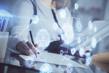 Multi exposure of woman's writing hand on background with data technology hud. Big data concept.