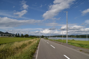 Landscape with road and field in Hokkaido, Japan