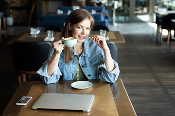 young girl drinking coffee and talking on the phone