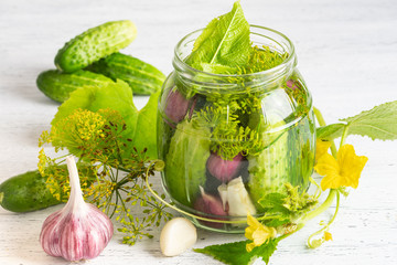 Pickled cucumbers on a light background.