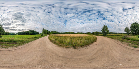 full seamless spherical hdri panorama 360 degrees angle view among fields in summer evening sunset...