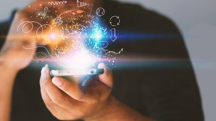 A man working with smartphone modern technology as social media concept.