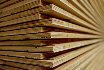 Stack of natural rough wooden boards. Wooden boards, lumber, industrial wood.