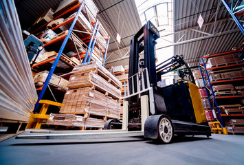 Forklift loader in storage warehouse ship yard. Distribution products. Delivery. Logistics. Transportation.