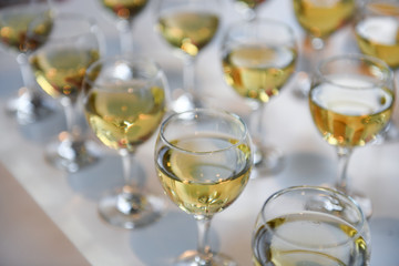 Glasses of white wine on the table
