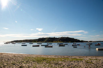 Resö, Sweden - July 15, 2019: View of small boats and a rock off the island of Resö in western Sweden. Land time exposure. Shake effects.