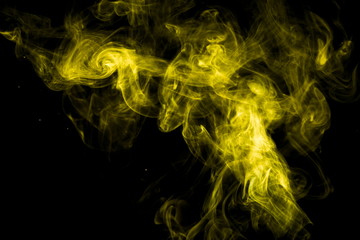 Yellow smoke on black background