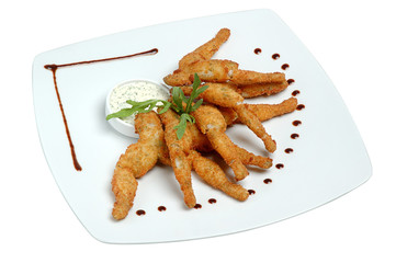 Fried chicken wings with sauce on a plate on a white isolated background