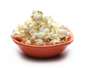 Popcorn in porcelain bowl isolated on white background