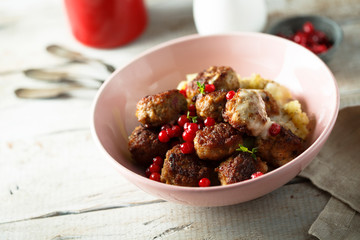 Meatballs with potato and red berries