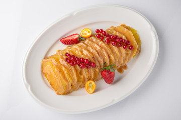 Dessert fried caramelized pineapple in own juice and berries. Banquet festive dishes. Fine dining restaurant menu. White background. 