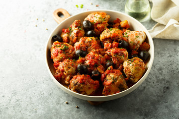 Roasted chicken with tomato and olives