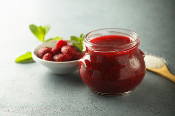 Homemade raspberry jam with fresh mint