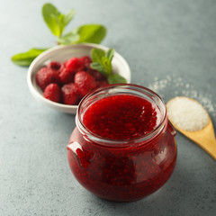 Homemade raspberry jam with fresh mint