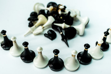 black and white pawns on a chessboard