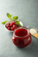 Homemade raspberry jam with fresh mint