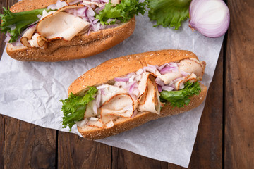 Hotdog with breast turkey on wood