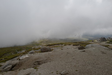 clouds engulfing mountains