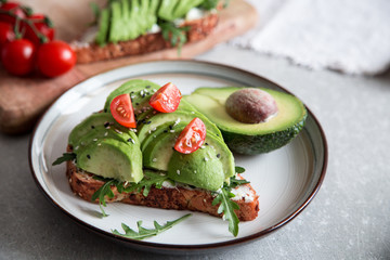 healthy breakfast with avocado and Delicious wholewheat toast. sliced avocado on toast bread with spices. Mexican cuisine