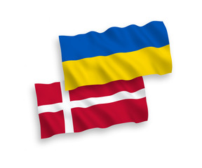 National vector fabric wave flags of Denmark and Ukraine isolated on white background. 1 to 2 proportion.