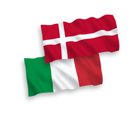 National vector fabric wave flags of Italy and Denmark isolated on white background. 1 to 2 proportion.