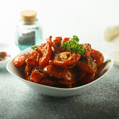 Homemade sun dried tomatoes with herbs