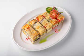 Quiche, casserole, delicious omelet from eggs, cheese, salmon, broccoli, spinach, pate. Banquet festive dishes. Gourmet restaurant menu. White background.