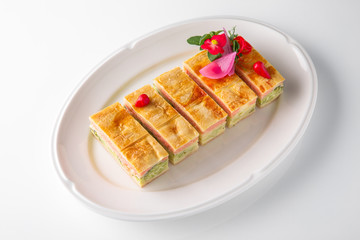 Quiche, casserole, delicious omelet from eggs, cheese, salmon, broccoli, spinach, pate. Banquet festive dishes. Gourmet restaurant menu. White background.