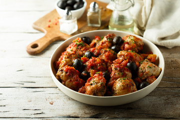 Roasted chicken with tomato and olives