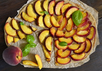 Crostata with peaches and fresh basil, tart, flat lay
