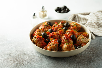Roasted chicken with tomato and olives