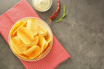Crispy potato chips with delicious sauce. Top view. Copy space.