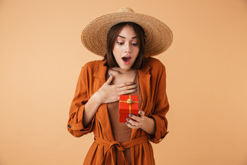 Beautiful young woman wearing straw hat