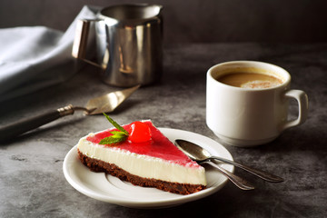 Cheesecake with cherry on dark background. Homemade cake, dessert.