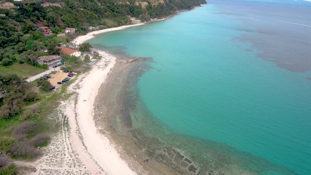 Aerial view of turquoise stunning beach, Athitos Halkidiki Greece,move forward and downward by drone
