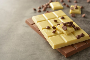 White and milk chocolate isolated. Top view of various chocolate bars with copy space.